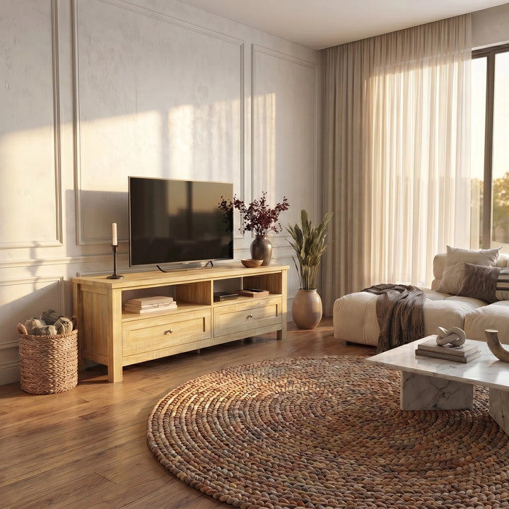 [Oak] Oskara TV Unit with Storage in oak effect finish styled in a bright living room with a TV above, open shelving, two drawers and a jute rug in the foreground