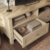 [Oak] Oskara TV Unit with Storage close-up showing left drawer pulled open with books, cables and glasses stored inside alongside an open shelf with stacked books