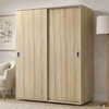 [Oak] Torvek 2 door sliding wardrobe angled view fully closed in a light neutral bedroom with gold floor lamp