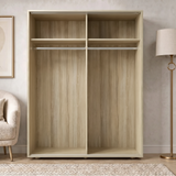 [Oak] Torvek wardrobe fully open showing empty interior with two hanging rails and upper shelving in bedroom