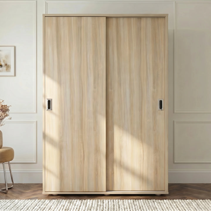 [Oak] Torvek 2 door sliding wardrobe fully closed front view styled in a neutral bedroom with floor lamp