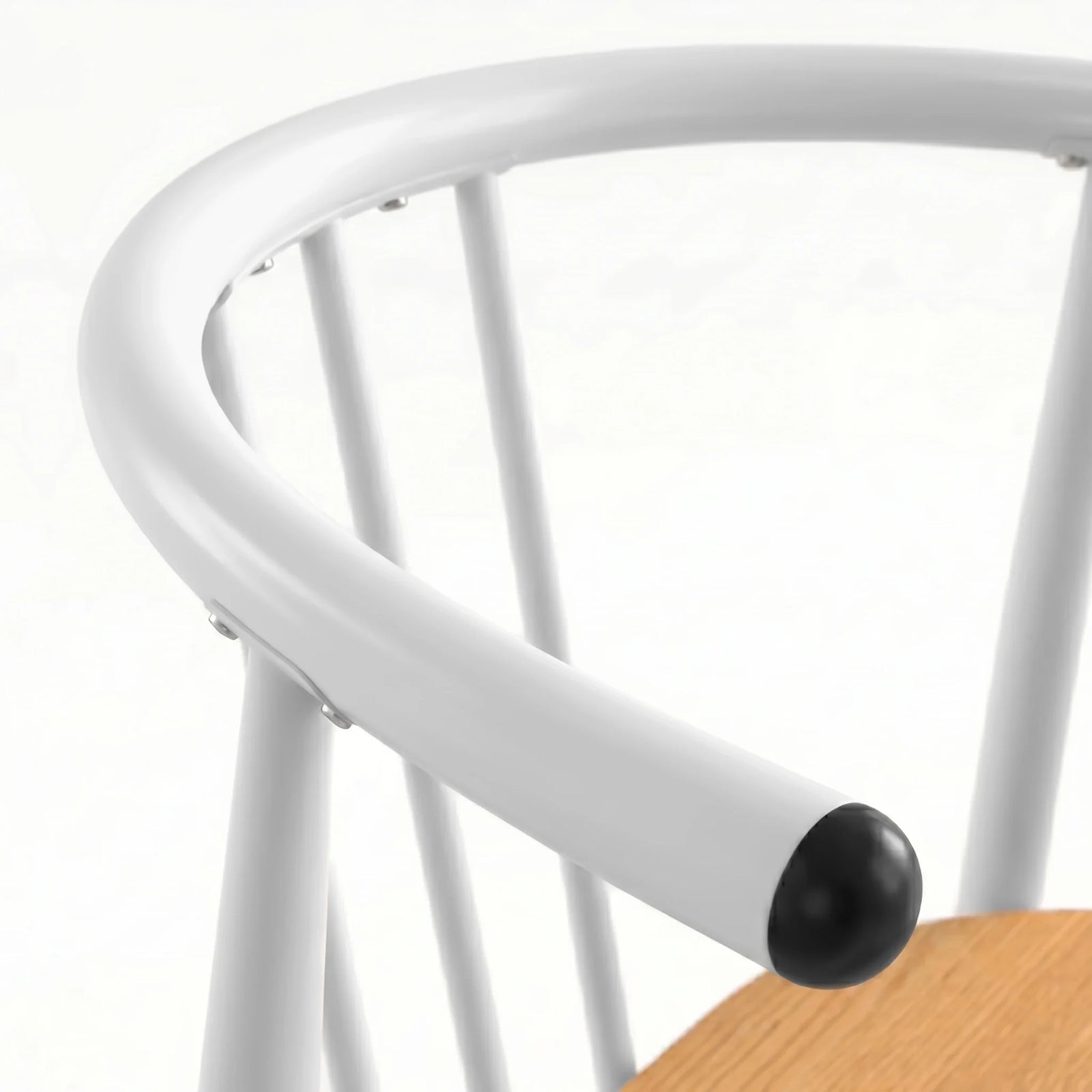 [Oak] Torvi chair curved white metal backrest and armrest detail with black rubber end cap close-up