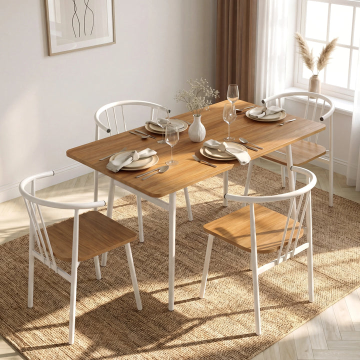[Oak] Torvi 4 seater dining set in a bright dining room with jute rug, place settings, wine glasses, and pampas grass by the window