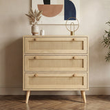 [Oak Effect] Wovena chest of drawers front view with three rattan-panel drawers, oak knobs, tapered legs, and vase on top