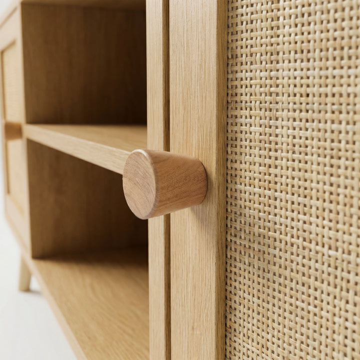 [Oak] Wovena close-up detail of solid oak cone knob handle against hand-woven rattan cane door panel weave texture