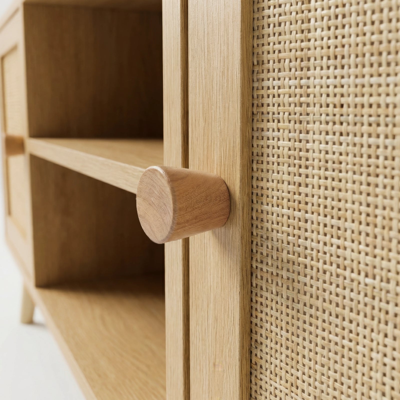 [Oak] Wovena close-up detail of solid oak cone knob handle against hand-woven rattan cane door panel weave texture