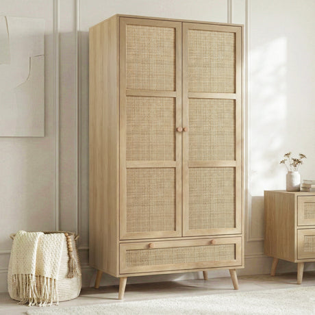 [Oak Effect] Wovena wardrobe three-quarter angle showing rattan door panels and tapered legs in a styled bedroom