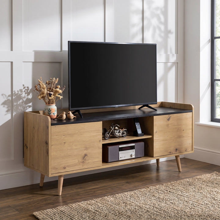 [Oak] Larvik TV Unit Cabinet with Storage for TVs up to 50" - Natural styled with a TV on top in a bright living room.