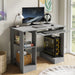 Home office computer desk with shelves in grey featuring a pull-out keyboard tray, monitor, and PC tower setup. Ideal for working, reading, and gaming.