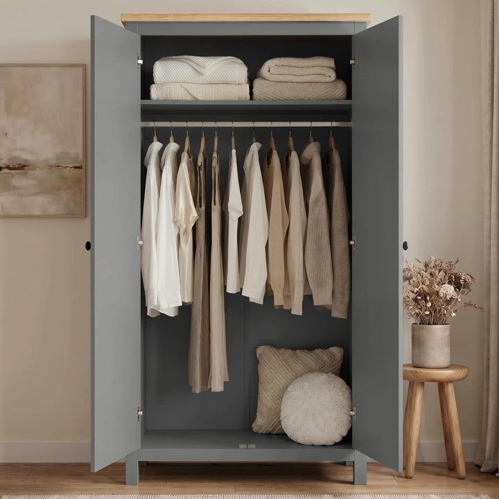 [Grey] Haven Grey 2 Door Double Wardrobe with Shelves and Hanging Rail open showing hanging clothes, blankets, and pillows.
