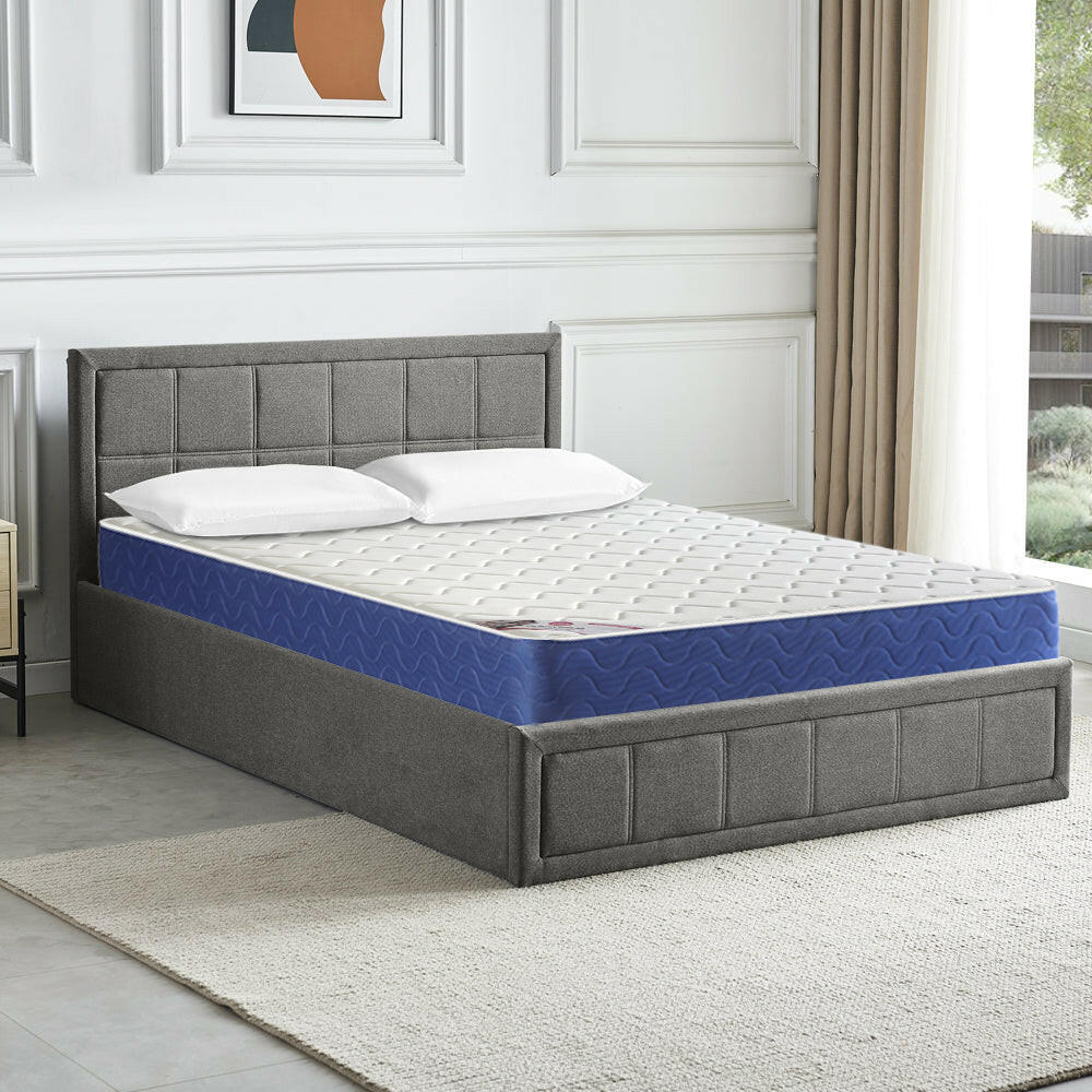 King size ottoman bed with mattress, featuring spacious storage and a comfortable sleeping surface.