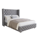 Grey upholstered ottoman bed with storage a tufted wingback headboard, studded detailing.