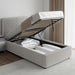 Corduroy ribbed velvet upholstered ottoman bed frame with end lift storage in light grey, shown open with bedding stored inside. Ideal for modern bedrooms.