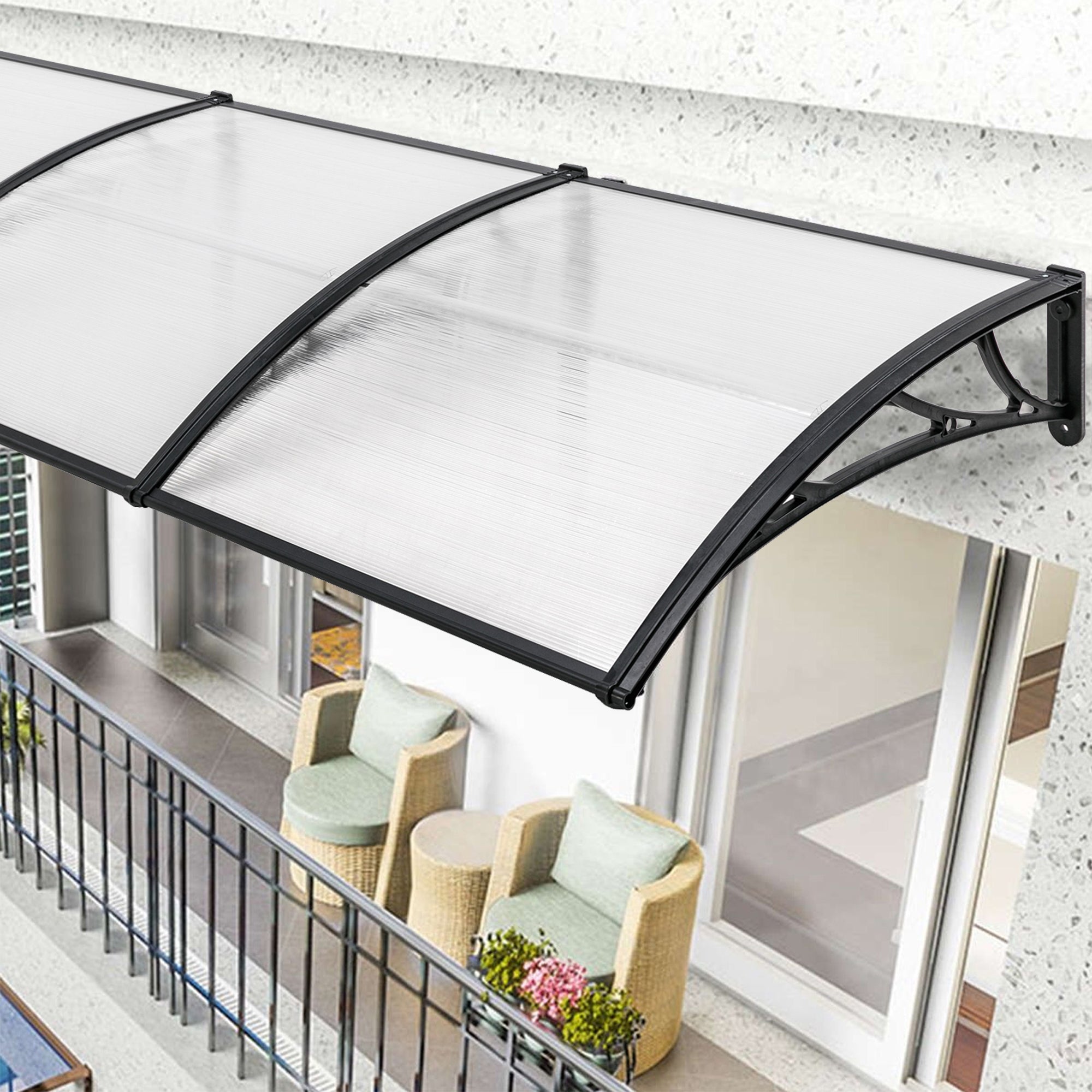 Over door rain canopy with clear polycarbonate roof and black frame for weather protection.