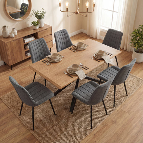 Overhead shot of Xylon dining table set, featuring 6 grey striped chairs and a neutral light dining room layout.