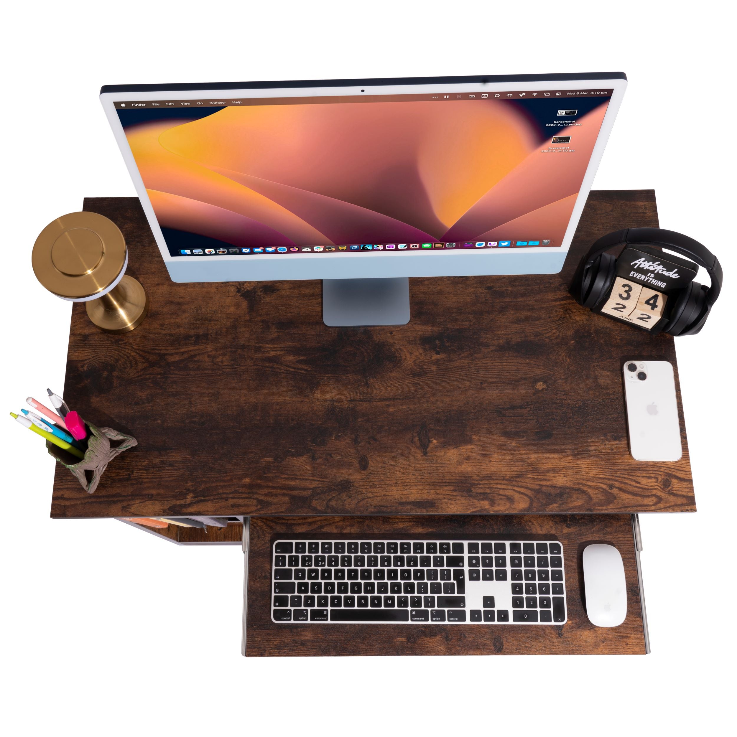 Top view of a rustic brown pc in desk with monitor, keyboard, mouse, and accessories.