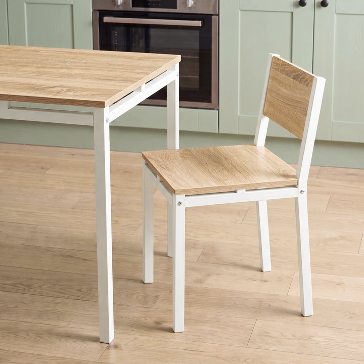 [Pine] Breakfast table edge & chair close-up with wood-effect panels, square grey metal frames, support rails & visible bolts