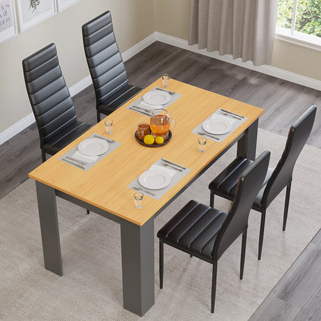 top down view showing pine wood textured pine dining tables and chairs with black leather seats