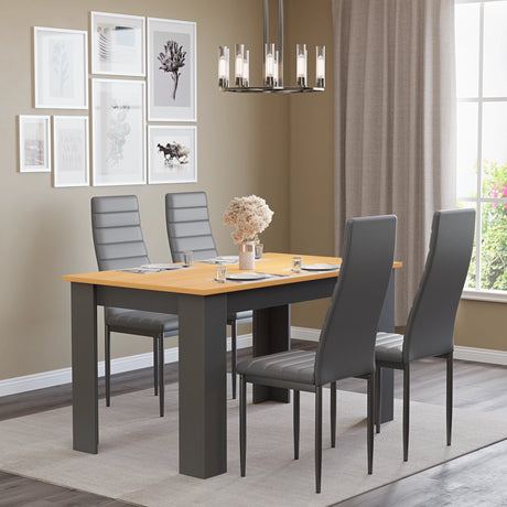 minimalistic dining setup with small dining table set for 4 and grey leather chairs plus and a centerpiece table decoration