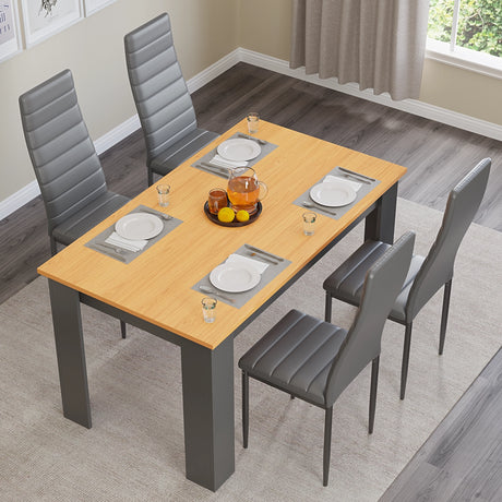 overhead view of pine wood kitchen table and chairs set of 4 with grey leather seats and tableware