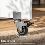 [Pine] Dining table with wheels close-up view showing a 360-degree swivel caster and foot-operated brake.