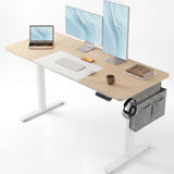 Pine Electric Standing Desk with dual monitors, laptop, and storage pocket, ideal for modern home office setups. Features adjustable height and cable management.