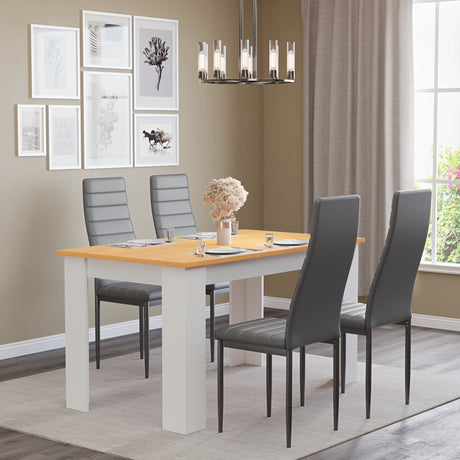 small dining table and 4 chairs in grey leather chairs in minimalistic dining room setup with four tableware and centerpiece