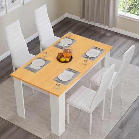 top-down view of white pine small dining table set for 4 with white leather chairs and simple table setting