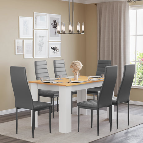 large white pine outdoor dining set with grey leather chairs arranged in minimalist indoor dining room setting