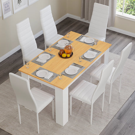 A top down view of white pine 6 seater outdoor dining set with white leather chairs arranged neatly in bright dining room