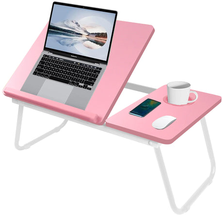 pink sofa laptop table fully opened with a raised surface holding a laptop and a cup in its holder