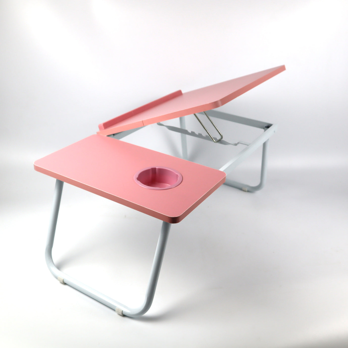 Pink height-adjustable laptop desk, designed for ultimate comfort, perfect for working or reading from bed or the sofa with an easy setup.