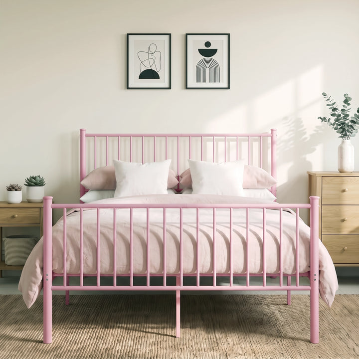 [Pink | King] Full front view of metal king bed with pink-white bedding, bar ends, centre leg, bedside plants & abstract art.