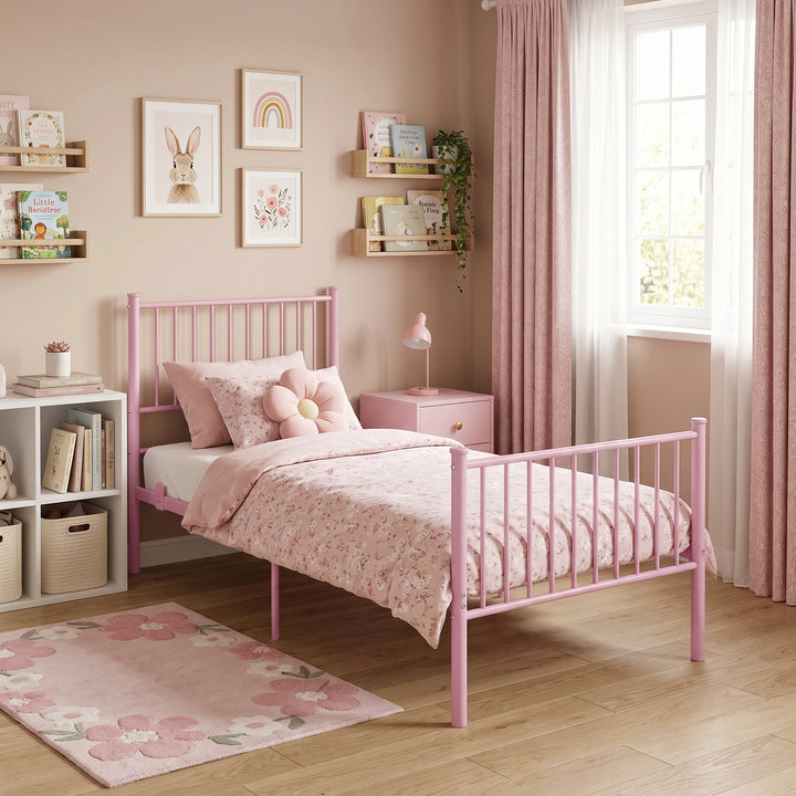 [Pink | Single] Bedroom scene showing a metal bed, floral bedding, flower cushion, bookshelves, trailing plant, and window.