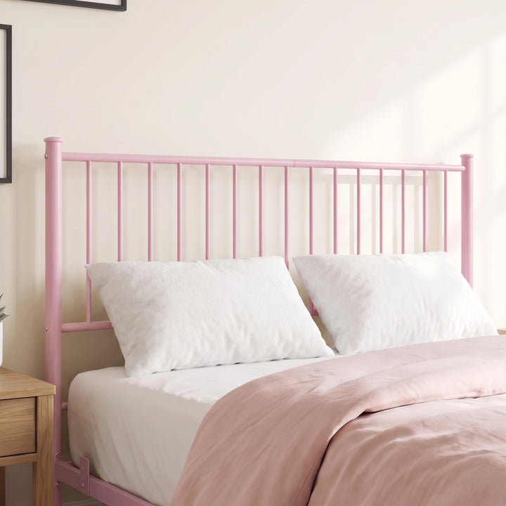 [Pink | King] Metal bed close-up of tall pink vertical-bar headboard with white pillows, pink bedding and abstract wall art.