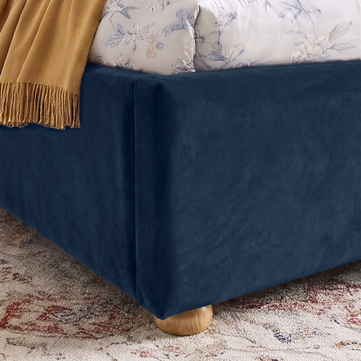 [King | Blue] Close-up showing plush velvet footboard, side rail and raised wooden foot