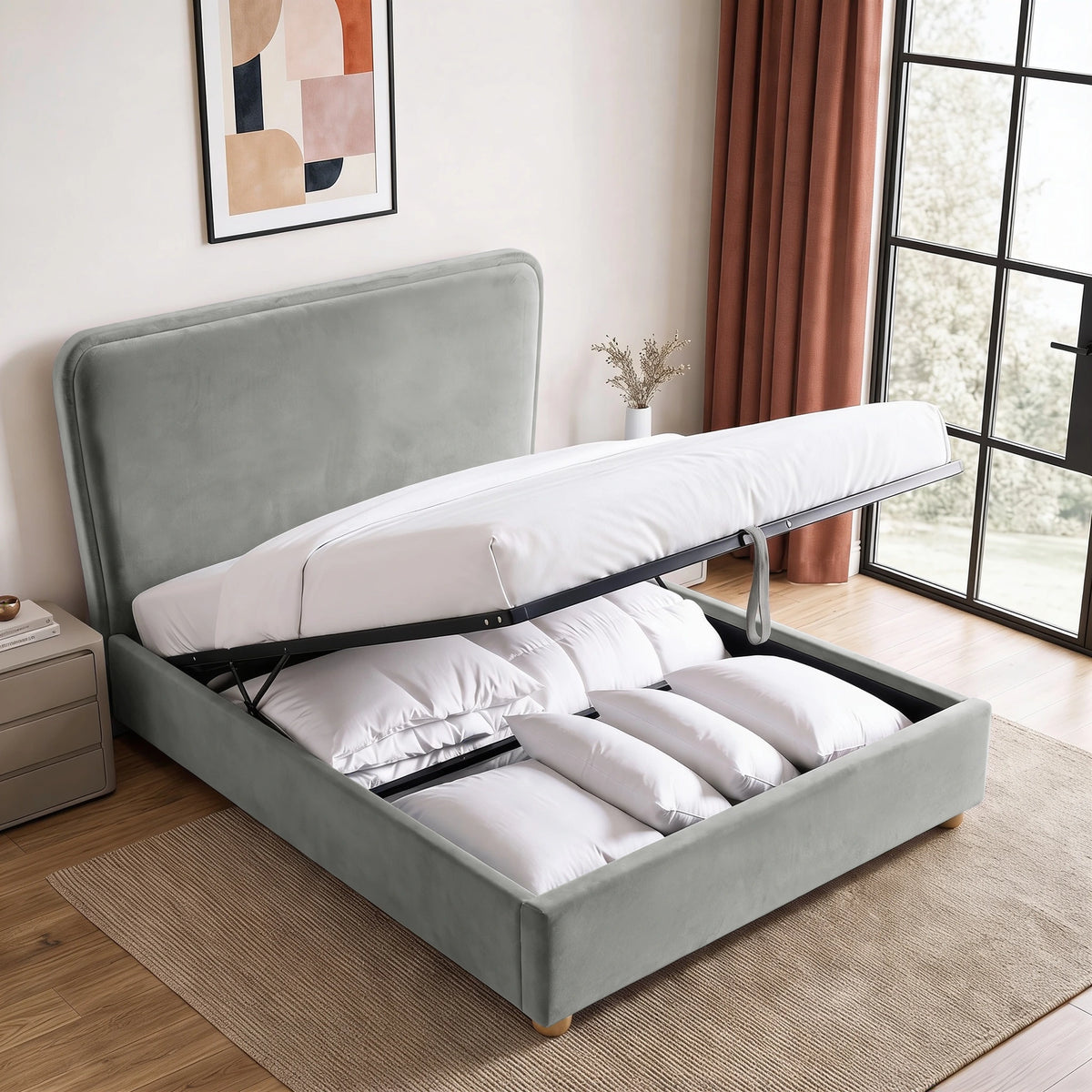 [King | Light Grey] Plush velvet Ottoman storage bed open showing gas-lift pistons, wooden slats, pull strap and storage bay