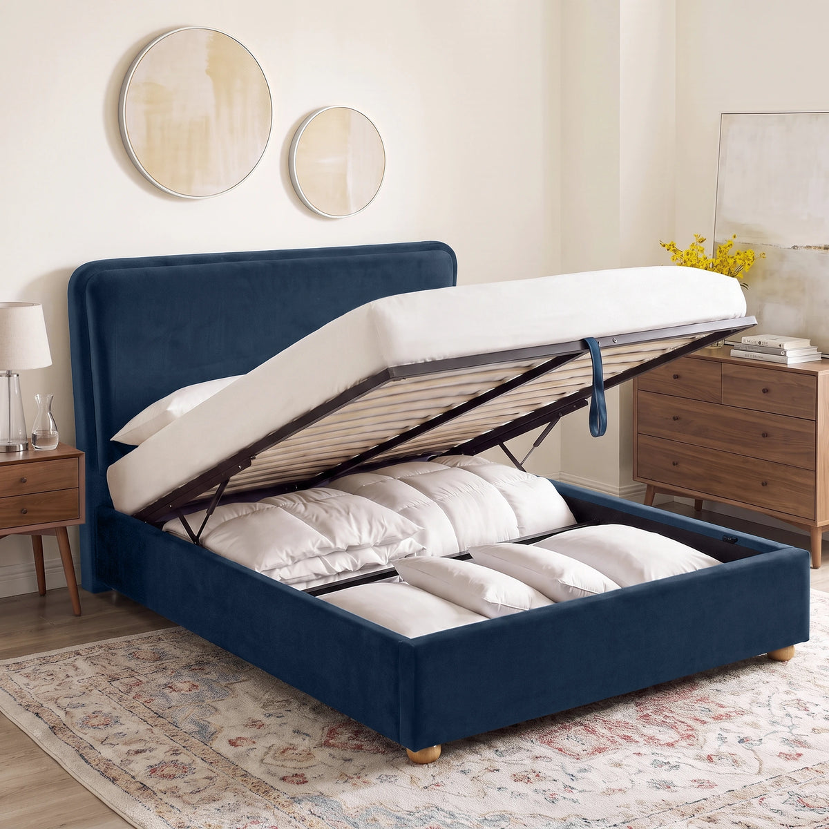 [King | Blue] Plush velvet Ottoman storage bed open showing gas-lift pistons, wooden slats, pull strap and storage bay
