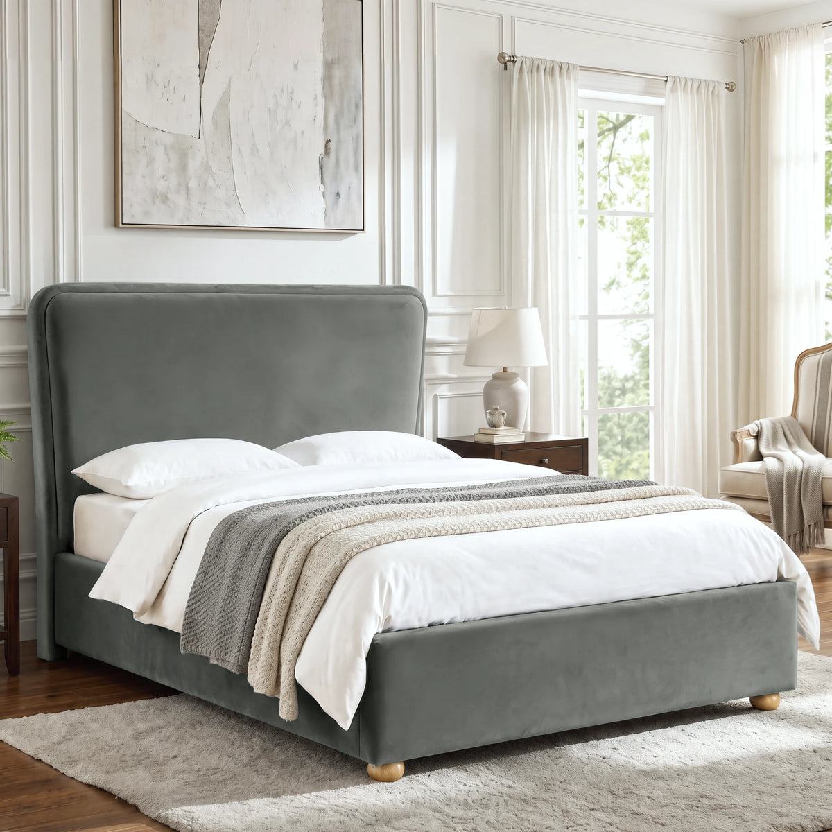 [Double | Grey] Angled lifestyle view of the Plush Velvet Ottoman Double Bed Frame - Grey in an elegant modern bedroom.
