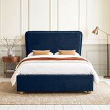 [Double | Blue] Front view of plush velvet ottoman bed with wide 120cm padded headboard, with wooden legs on footboard