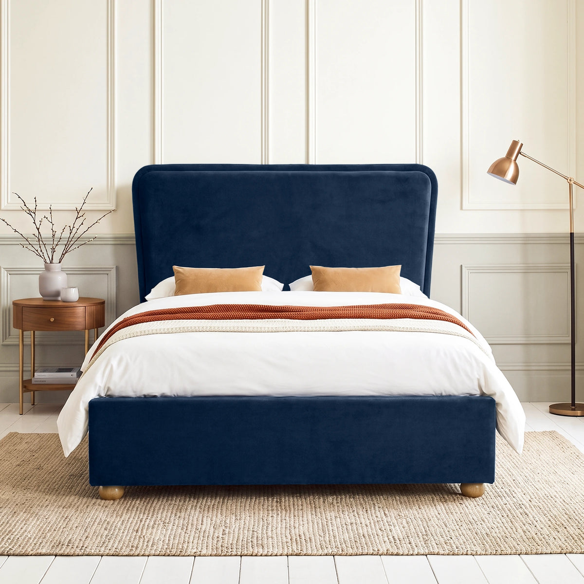 [Double | Blue] Front view of plush velvet ottoman bed with wide 120cm padded headboard, with wooden legs on footboard