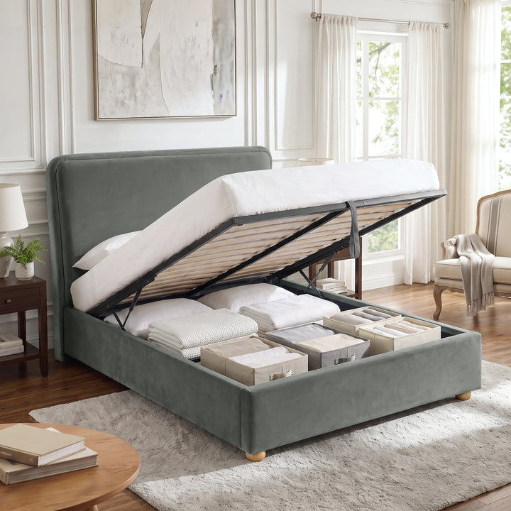 [Double | Grey] Plush velvet Ottoman storage bed open showing gas-lift pistons, wooden slats, pull strap and storage bay