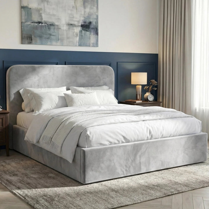 [Light Grey | King] Pluva velvet ottoman bed side angled, navy panelled wall, two black-shade lamps on wood bedside cabinets