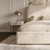 [Small Double | Beige] Angled view of velvet ottoman bed showing headboard curve and upholstered side panel with bedding