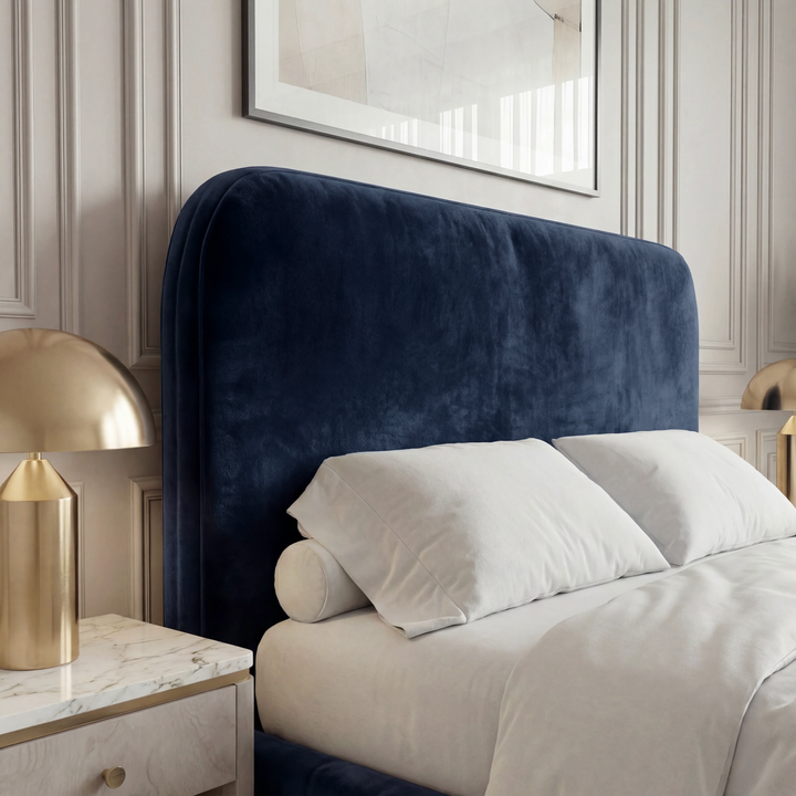 [King | Blue] Close-up of Pluva curved velvet headboard showing smooth padded upholstery and rounded top edge