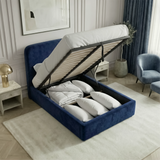 [Single | Blue] Mattress lifted on hydraulic struts showing full-depth storage compartment with neatly organised bedding