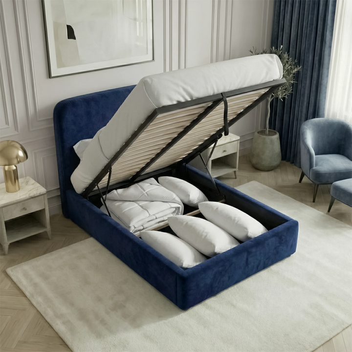 [Single | Blue] Mattress lifted on hydraulic struts showing full-depth storage compartment with neatly organised bedding