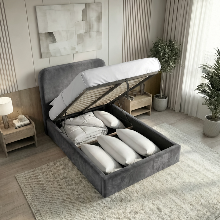 [Single | Grey] Gas-lift mechanism raised on Pluva ottoman bed revealing spacious under-bed storage with pillows and duvets