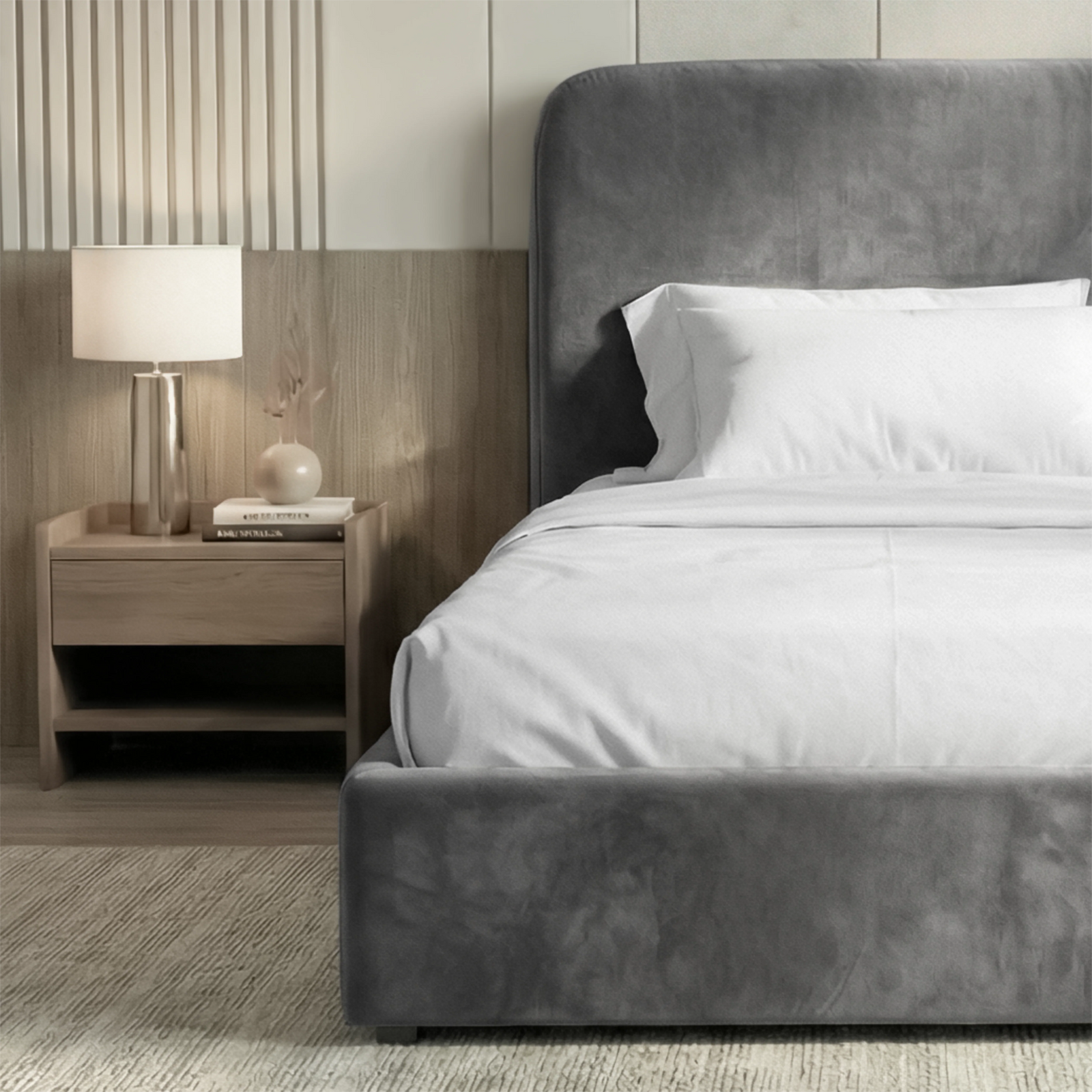 [Single | Grey] Side angle of Pluva ottoman bed showing curved headboard profile and clean velvet base beside nightstand