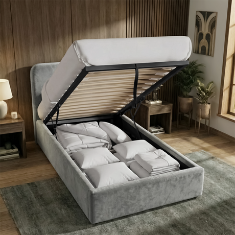 [Single | Light Grey] Gas-lift mechanism raised on Pluva ottoman bed revealing spacious under-bed storage with pillows and duvets